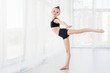 © svetabezu - Flexible child, beautiful little gymnast girl doing gymnastic exercises or exercising in fitness class