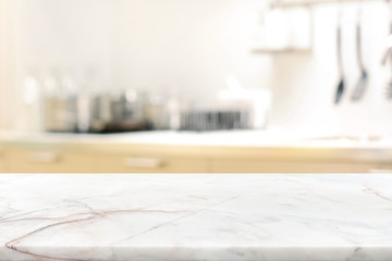 marble stone table top (kitchen island) on blur kitchen interior background