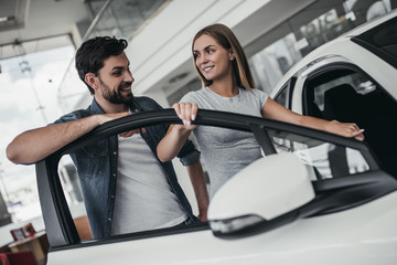 Poster - Couple at car dealership