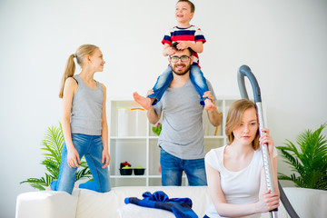 Wall Mural - Tired mother vacuum cleaning