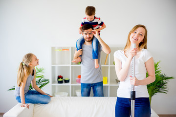 Wall Mural - Housewife vaccuum cleaning