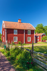 Wall Mural - Old traditional red wooden Swedisch house