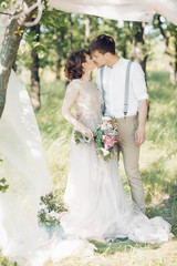 Wall Mural - wedding couple on  nature.  bride and groom hugging at  wedding. 