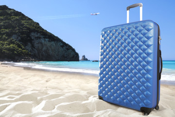 suitcase on sand 