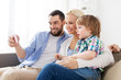 © Syda Productions - happy family with smartphone at home