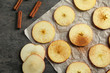 © Africa Studio - Composition with fresh cut apples and cinnamon prepared for making chips, on grey table