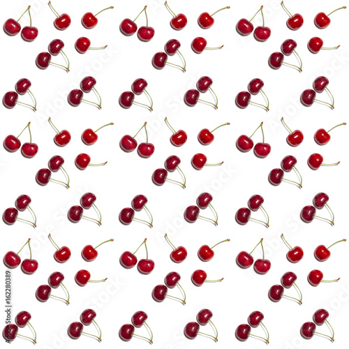 pattern of red shiny sweet cherry berries