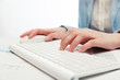 © Wrangler - Business woman using computer mouse and keyboard