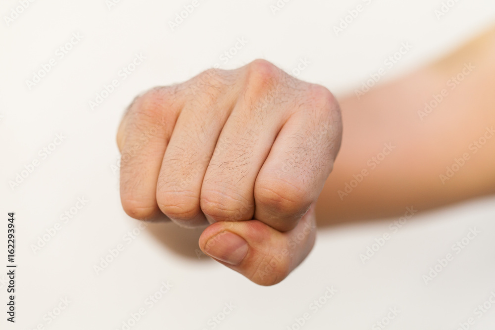 Photo Stock Mano en forma de puño con fondo blanco | Adobe Stock