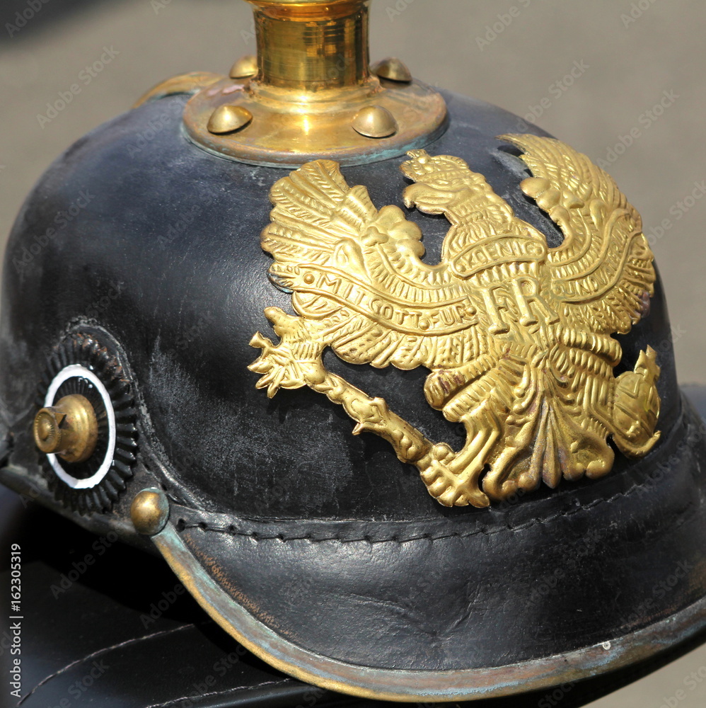 Closeup of a German WW1 Pickelhaube showing the emblem and motto