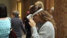 Woman Wearing VR Headset At Museum