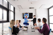 © .shock - boss dresed as bear having fun with business people in trendy office