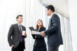 © Atstock Productions - Business people meeting and talking at office building hallway