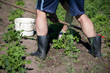 © STOATPHOTO - Man working garden with a hoe. Hobbies and ecological living background