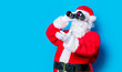 © Masson - Funny Santa Claus have a fun with binoculars