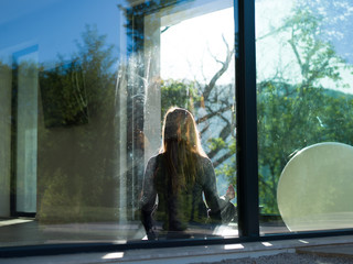 young woman doing morning yoga exercises