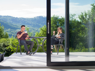 couple enjoying morning coffee and breakfast