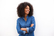 © mimagephotos - Beautiful happy black woman standing with arms crossed