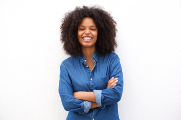 beautiful positive african american woman standing with arms crossed