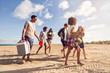 © Drobot Dean - Multiracial group of friends walking at beach