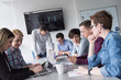 © .shock - Group of young people meeting in startup office