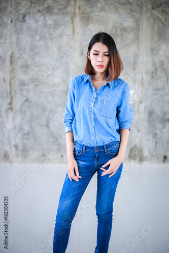 Asian Woman Casual Outfits Standing In Jeans And Blue Denim Shirt