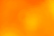 Orange abstract blur background with lens flare