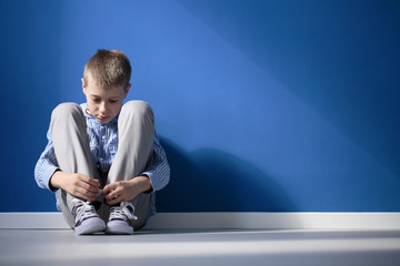 Wall Mural - Depressed boy in a room