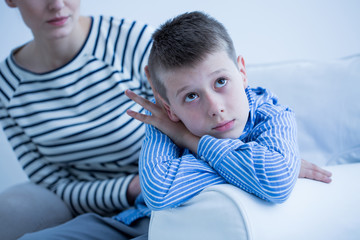 Wall Mural - Sad boy and his mom