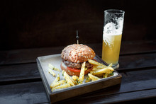 Fast Food Set: Hamburger, Beer And Fries. Background Old Wood