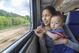 Fototapeta  - Mother and her son have a journey by train