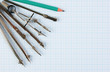 © arbalest - Old drawing tools on graph paper