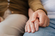 © zinkevych - Close up of elderly married people while holding hands