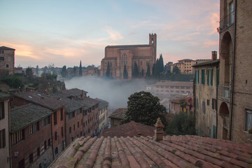 Wall Mural - Basilica Cateriniana or Basilica of San Domenico in the mist, Siena, Tuscany, Italy.