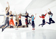 © iordani - Women doing sport in gym, jumping, healthcare lifestyle people concept, modern loft studio