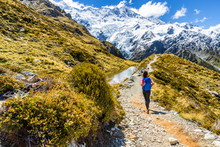 New Zealand Hiking Girl Hiker On Mount Cook Sealy Tarns Trail In The Southern Alps, South Island. Travel Adventure Lifestyle Tourist Woman Walking Alone On Mueller Hut Route In The Mountains.