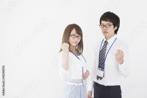 ビジネス 男女2人 ガッツポーズ カメラ目線 上着なし ネームプレートと眼鏡 Stock Photo Adobe Stock