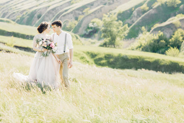 Wall Mural - wedding couple on  nature.  bride and groom hugging at  wedding. 