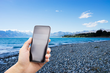 Wall Mural - mobile phone with empty beach