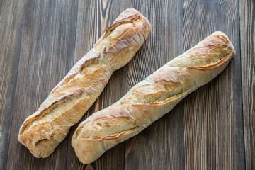 Canvas Print - Two baguettes on the wooden background