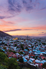 Wall Mural - Sunset panorama view of Tbilisi, capital of Georgia country, from Narikala fortress.