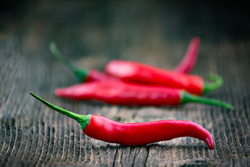 Poster - Fresh red chilli pepper on a wooden table