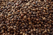 Closeup background of pepper seeds. Peppercorns.