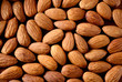 Peeled almonds closeup. Nuts background.