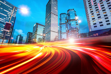 The light trails on the modern building background in Hong Kong