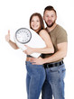 Couple with scale is proud to lose weight 