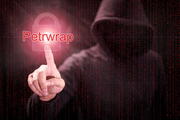 Wall Mural - Male hacker pointing Petrwrap or Petya ransomware and red padlock symbol with digital binary code background. cyber attack and internet security concepts