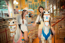 Asian Pretty Girls Going To The Amusement Park