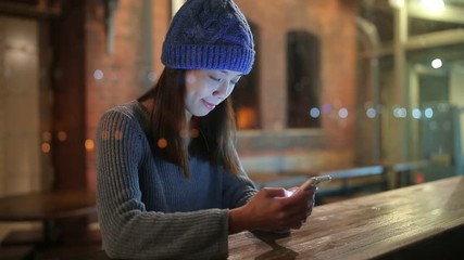 Wall Mural - Woman use of mobile phone at night