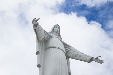 Wallpaper Virgin Maria statue in the church of Guadalupe, Bogotà, Colombia. On Blu Sky